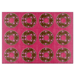 Chocoladedonuts op een roze hotboard snijplank