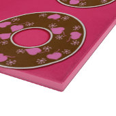 Chocoladedonuts op een roze hotboard snijplank (Hoek)