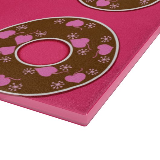 Chocoladedonuts op een roze hotboard snijplank (Hoek)