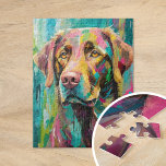 Chocolate Lab Portret Kleurrijke Abstracte Kunst Legpuzzel<br><div class="desc">Een speels kunstportret van een chocoladelab geschilderd met grillige felle kleuren, waaronder blauwgroen, geel, roze en groen. Het levendige palet en de expressieve penseelstreken geven de hond een energieke, vreugdevolle uitstraling en geven een leuke en fantasierijke draai aan traditionele huisdierenportretten. Dit levendige en kleurrijke stuk legt de persoonlijkheid van de...</div>