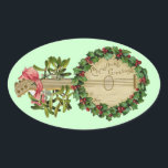CHRISTMAS BANJO MET MISTLETOES EN HOLLY BERRIES OVALE STICKER<br><div class="desc">Elegant ornamental  muziekinstrument met bloemkroon.</div>