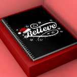 Christmas Believe Santa Claus - Santa Hat Zwart Notitieboek<br><div class="desc">Omarm de magie van het vakantieseizoen met ons 'Christmas Believe Santa Claus - Santa Hat Black'-ontwerp. Met een klassieke kerstmuts en de tijdloze boodschap van geloven in de vreugde en het wonder van Kerstmis, is dit feestelijke ontwerp perfect voor het verspreiden van feestvreugde. Of je nu een echte gelovige in...</div>