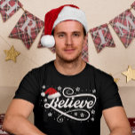 Christmas Believe Santa Claus - Santa Hat Zwart T-shirt<br><div class="desc">Omarm de magie van het vakantieseizoen met ons 'Christmas Believe Santa Claus - Santa Hat Black'-ontwerp. Met een klassieke kerstmuts en de tijdloze boodschap van geloven in de vreugde en het wonder van Kerstmis, is dit feestelijke ontwerp perfect voor het verspreiden van feestvreugde. Of je nu een echte gelovige in...</div>