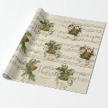 Christmas Bell Music Cadeaupapier<br><div class="desc">Ring in the New Year with this design featuring vintage bells and sheet music. Bells are adorned with greenery, mistletoe, and pink flowers. Below each bell is a Christmas greeting. This design can also be found on tissue paper, greeting cards, stickers and Christmas ornaments. You can find more at the...</div>