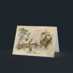 "Christmas Bell" Vintage Kerst Kaart<br><div class="desc">"Christmas Bell" is een collage afbeelding van vintage beelden over kerstavond. Het show een mooie oude koperen bel met "Noel" erop gegraveerd. Boven staan mooie witte bloesems met roze tips en wat groen. Een landelijke kerk in de sneeuw heeft zijn ramen verlicht voor de vakantie. Het verwacht de komst van...</div>