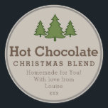 Christmas Hot Chocolate diy cadeau sticker<br><div class="desc">Deze sticker is ontworpen om aan doe-het-zelf cadeaus voor de feestdagen te bevestigen. Het heeft bruine tekst op een beige achtergrond, met brandbomen aan de bovenkant. Dit zou perfect zijn om flessen of potten met cacao en marshmallows te labelen als een eenvoudig zelfgemaakt kerstcadeau. Als alternatief kunt u de tekst...</div>