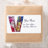 CHRISTMAS V LETTER/SANTA SPEELT HARP UIT ETIKET (Insitu)