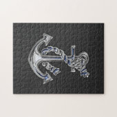 Chrome achtige hellingsanker op koolstofvezel legpuzzel (Horizontaal)