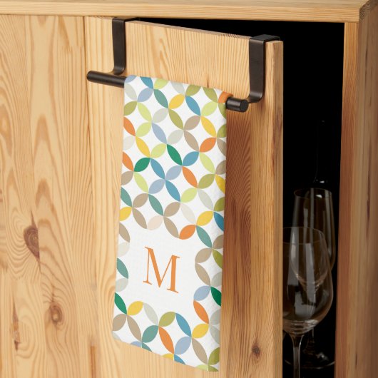 Circulair kwartspatroon warme toon-monogram theedoek (Derde Gevouwen)