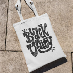 Citaat voor zwarte eenheid tote bag