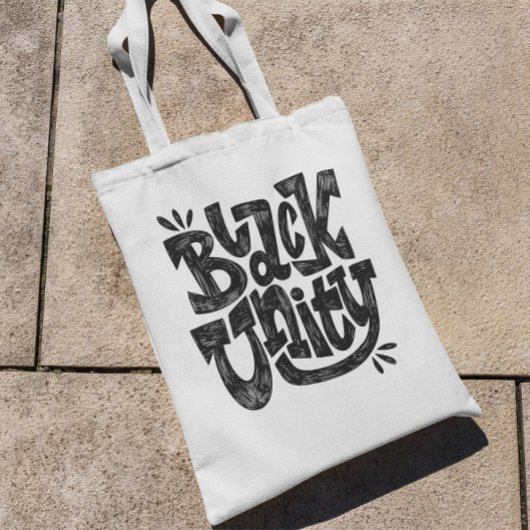 Citaat voor zwarte eenheid tote bag