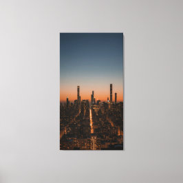 city lights turning on at dusk canvas afdruk