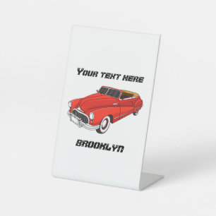 Classic red 1948 automobile reclamebord met voetstuk