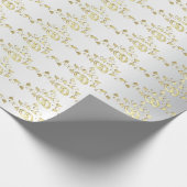 Classy gouden trouwringen op wit satijn cadeaupapier (Hoek)