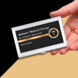 Classy medische visitekaartjes visitekaarthouder<br><div class="desc">Classy medisch visitekaartje hoesje in een gouden en zwarte professionele ontwerp met inbegrip van een medisch caduceus symbool dat uw medische praktijk,  medische beroep,  of dienst op een professionele manier cadeaus. Nieuw ontworpen voor een arts,  medisch bedrijf of thuisverpleegkundige.</div>