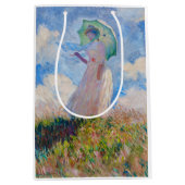 Claude Monet - Vrouw met een parasol naar links Medium Cadeauzakje (Voorkant)