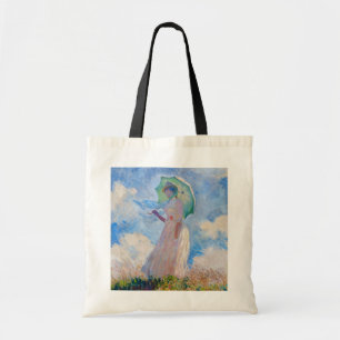 Claude Monet - Vrouw met een parasol naar links Tote Bag