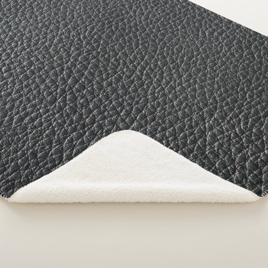 Close up of black leather texture and backgroundle sherpa deken (3/4)