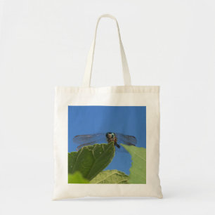 Close-up van een libel tegen een heldere blauwe lu tote bag