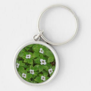 Close-up van kornoelje met witte bloemen sleutelhanger
