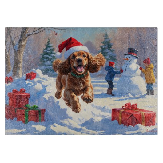 Cocker Spaniel rent in de sneeuw met kerstmuts Snijplank (Voorkant)