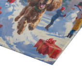 Cocker Spaniel rent in de sneeuw met kerstmuts Snijplank (Hoek)