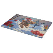Cocker Spaniel rent in de sneeuw met kerstmuts Snijplank (Hoek)