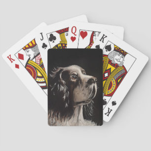 cocker spaniel spelend met pokerkaarten