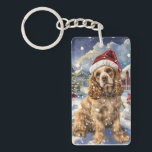 Cocker Spaniel Winter Wonderland Christmas Joy Sleutelhanger<br><div class="desc">Dit feestelijke ontwerp vangt de vrolijke sfeer van het vakantieseizoen, met een schattige pup die een kerstmuts draagt. De hond is genesteld in een winterwonderland, compleet met een sneeuwpop, een versierde kerstboom en prachtig ingepakte cadeaus. Sneeuwvlokken herfsten zachtjes en voegen een magische toets toe aan het tafereel, terwijl de levendige...</div>