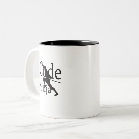 Code Ninja Tweekleurige Koffiemok (Voorkant links)