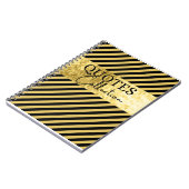 collectie met zwarte en goudkoersen notitieboek (Linkerzijde)