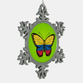Colombiaanse vlindervlag op groen tin sneeuwvlok ornament (Links)