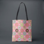 Colorful Donut Pattern Cute Sweet Treats Tote Bag<br><div class="desc">Carry your essentials in style with this colorful donut pattern tote bag. Featuring a seamless illustration of vibrant glazed doughnuts and sprinkles on a soft pink background, this reusable bag is perfect for grocery trips, beach days, or daily errands. The whimsical food art adds a cheerful touch to your outfit,...</div>