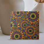 Colorful Floral Oriental Ethnic Mandalas Patroon Tegeltje<br><div class="desc">Deze keramische tegel heeft uitgebreide mandala-achtige motieven met prachtige details, die een caleidoscopische indruk geven. De tegel heeft twee hoofdpatronen: een die lijkt op een oogverblindende zon en een andere die bestaat uit ingewikkelde lagen van geometrische figuren die in cirkelvormige configuraties zijn gerangschikt. Geel, rood, blauw en zwart domineren het...</div>