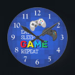 Colorful Gamer | Videogame-klok Ronde Klok<br><div class="desc">Een coole gamer klok voor al die mannen en jongens die van games houden! Hij zou elke kamer oplichten met zijn gedurfde kleuren.</div>