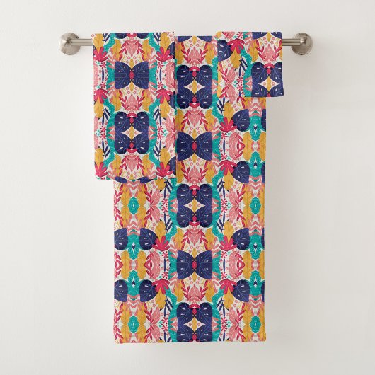 Colorful geometric-patterned towels hang  bad handdoek