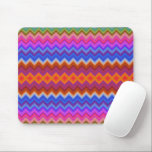 Colorful mouse pad featuring vibrant zigzag muismat<br><div class="desc">Colorful mouse pad featuring vibrant zigzag stripes in pink, blue, orange, and green hues. A white mouse rests beside it on a light surface.</div>