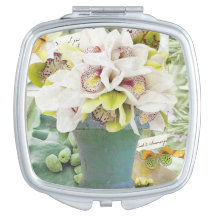 Compact spiegelbeeld met orchidee ontwerp