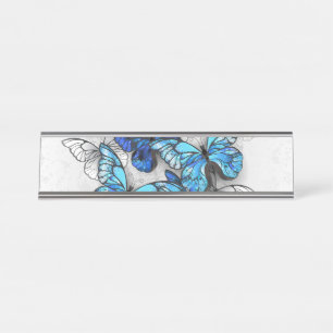 Compositie van witte en blauwe vlinders bureau naambordje