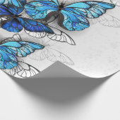 Compositie van witte en blauwe vlinders cadeaupapier (Hoek)