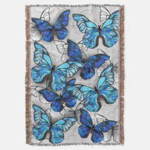 Compositie van witte en blauwe vlinders deken