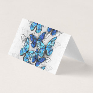 Compositie van witte en blauwe vlinders kaart