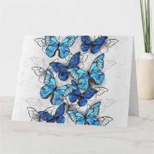 Compositie van witte en blauwe vlinders kaart