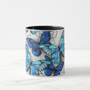 Compositie van witte en blauwe vlinders mok