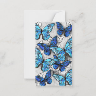 Compositie van witte en blauwe vlinders notitiekaartje