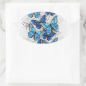Compositie van witte en blauwe vlinders ovale sticker (Tas)