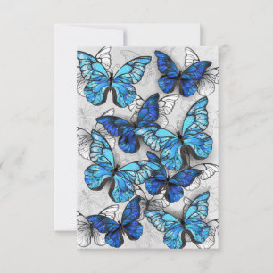 Compositie van witte en blauwe vlinders save the date