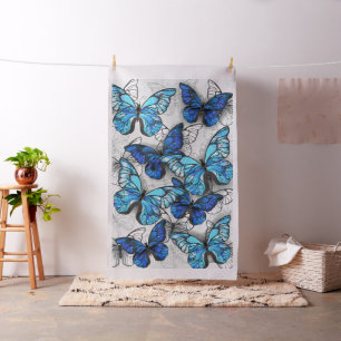 Compositie van witte en blauwe vlinders stof