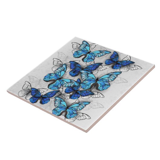 Compositie van witte en blauwe vlinders tegeltje (Zijkant)