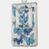 Compositie van witte en blauwe vlinders verzilverd omlijst ornament (Links)